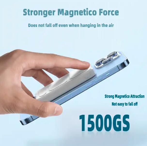 Hand holding custom logo magnetic power bank attached to smartphone with strong magnetico force