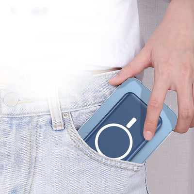 Person placing eprolo MagSafe magnetic wireless power bank into light blue denim jeans pocket